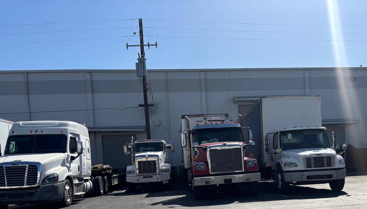 ATMS real red and white fleet trucks in yard